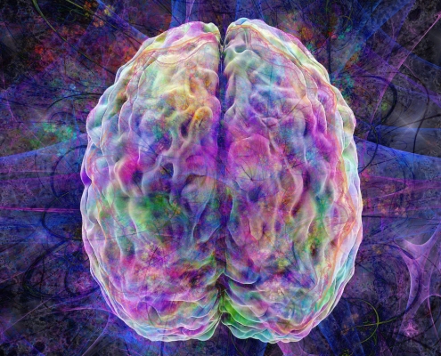 Looking top down at a multi-colored brain with electric-lines shooting out the sides.